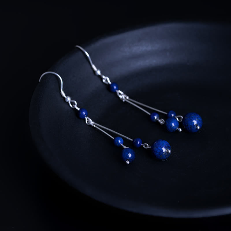 Pendientes colgantes Serenity con cuentas de lazurita y Buddha Stones en plata de ley 925