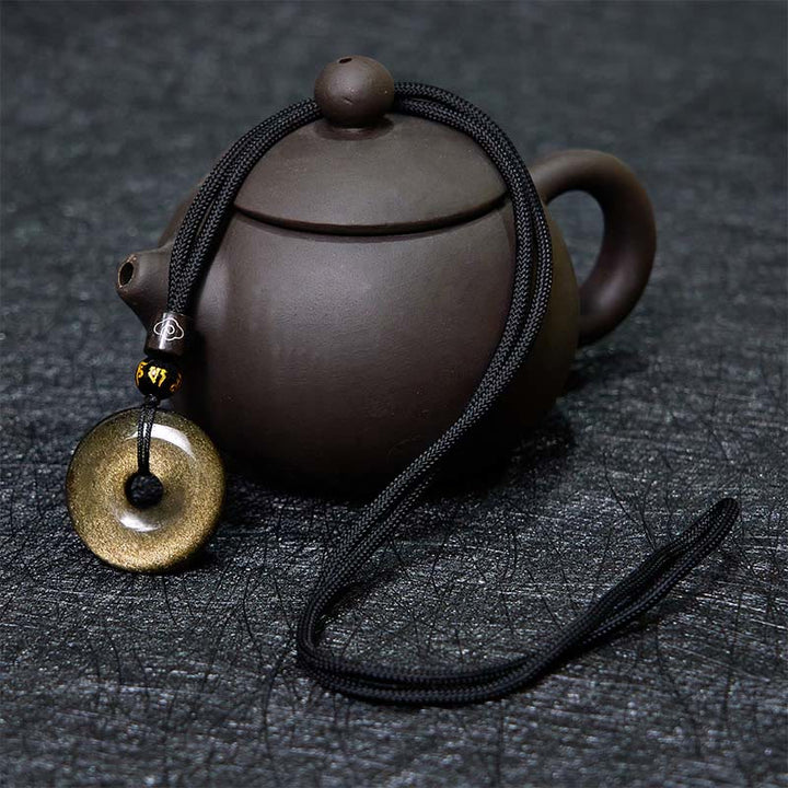 Colgante con hebilla de paz de obsidiana con brillo dorado natural y Buddha Stones