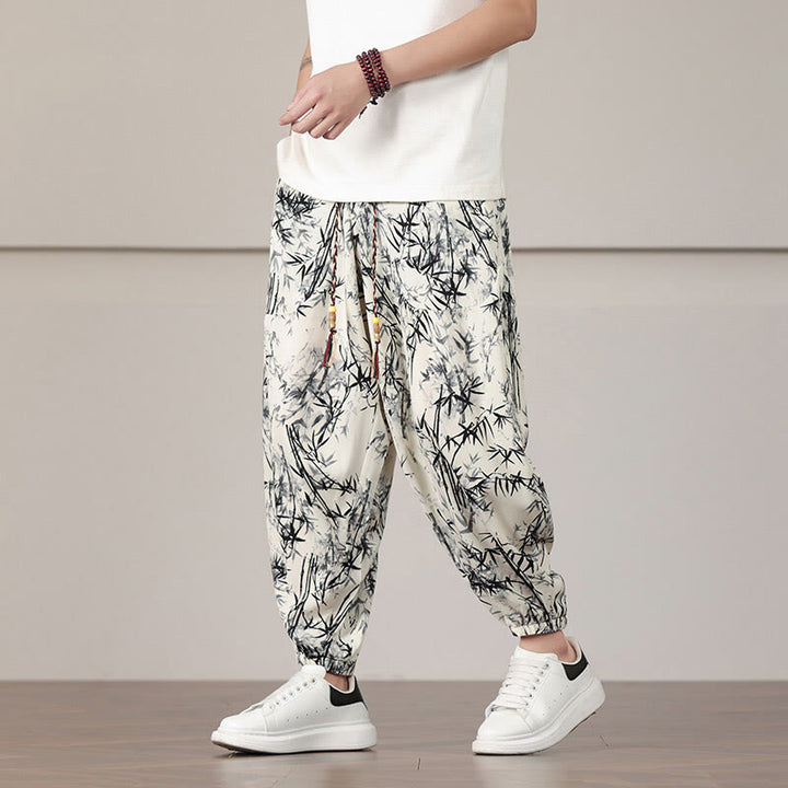 Pantalones harén con cordón y bolsillos para hombre con estampado de hojas de bambú y Buddha Stones - image 1