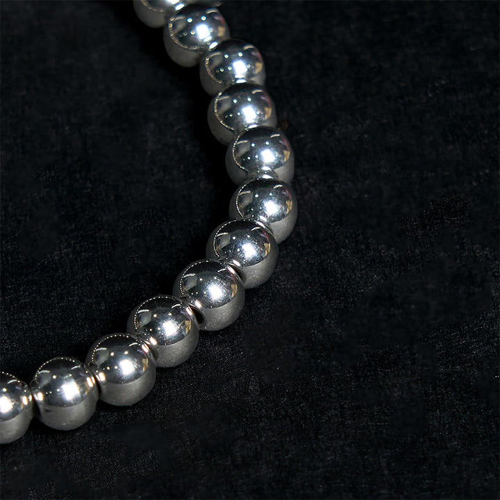 Pulsera de equilibrio de buena suerte de acero y titanio con Buddha Stones