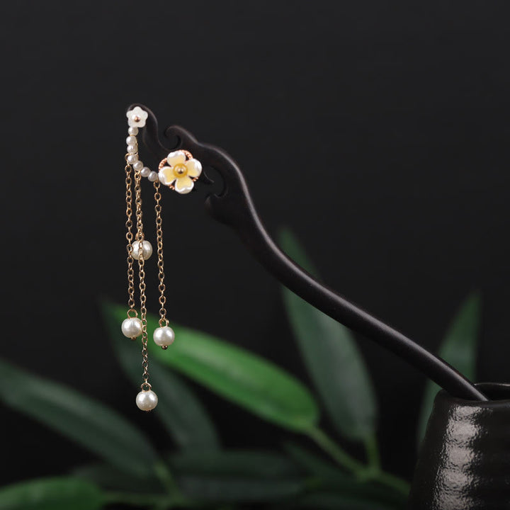 Horquilla con borla de perla, flor de concha de ébano y Buddha Stones