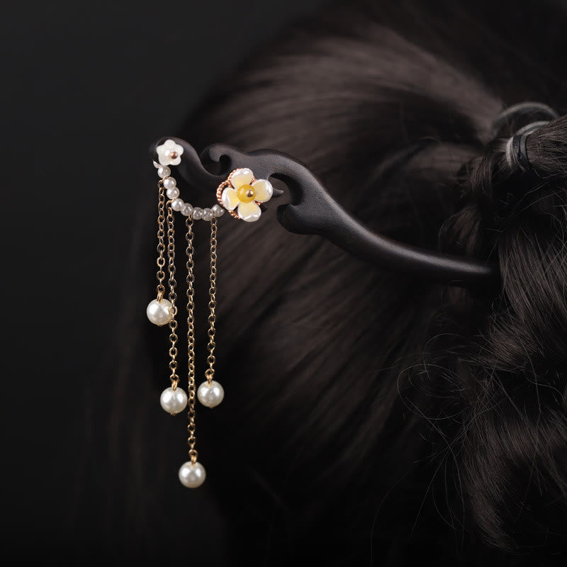 Horquilla con borla de perla, flor de concha de ébano y Buddha Stones