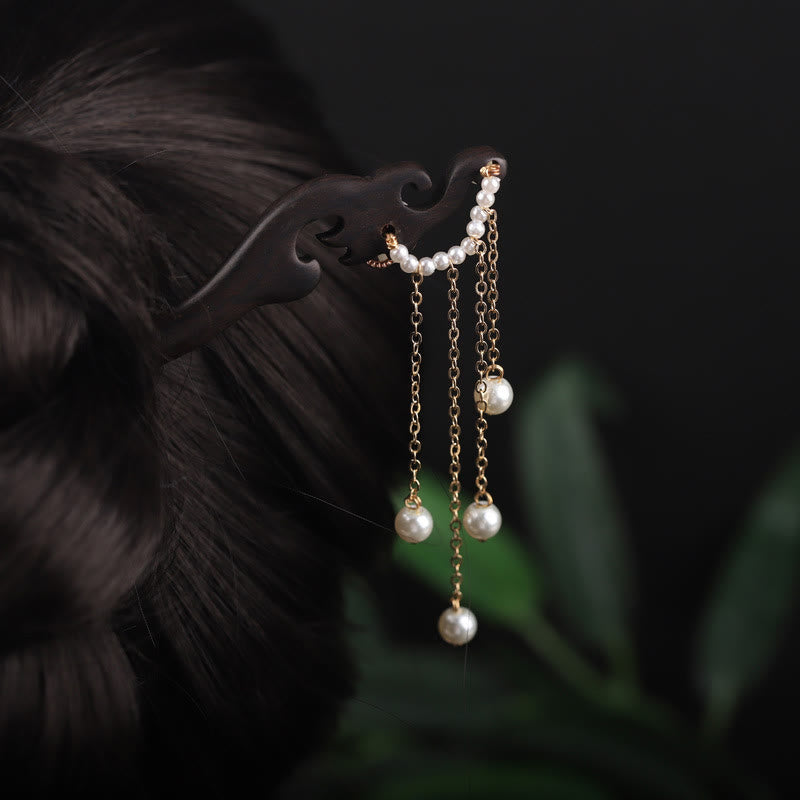 Horquilla con borla de perla, flor de concha de ébano y Buddha Stones