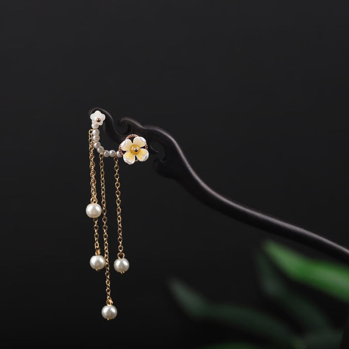 Horquilla con borla de perla, flor de concha de ébano y Buddha Stones