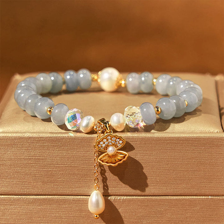 Pulsera de cuentas curativas de concha de perla y aguamarina natural de Buddha Stones