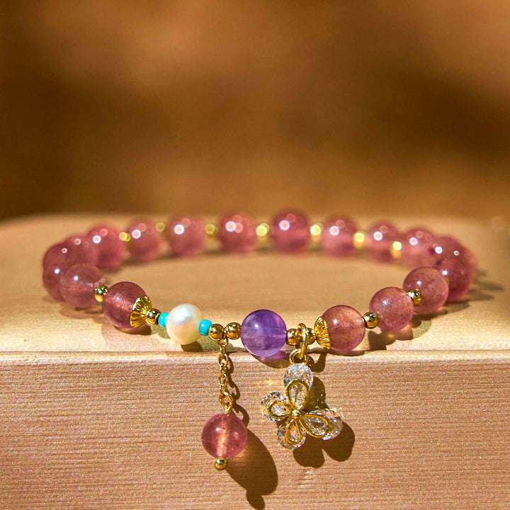 Pulsera con dije de mariposa de cuarzo fresa natural y cuarzo fresa verde de Buddha Stones