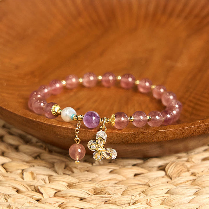 Pulsera con dije de mariposa de cuarzo fresa natural y cuarzo fresa verde de Buddha Stones