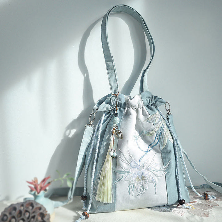 Bolso bandolera de lona con bordado de Buddha Stones, verde pera y epifilo azul.