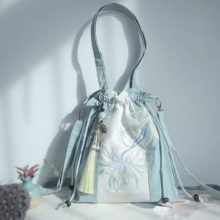 Bolso bandolera de lona con bordado de Buddha Stones, verde pera y epifilo azul.
