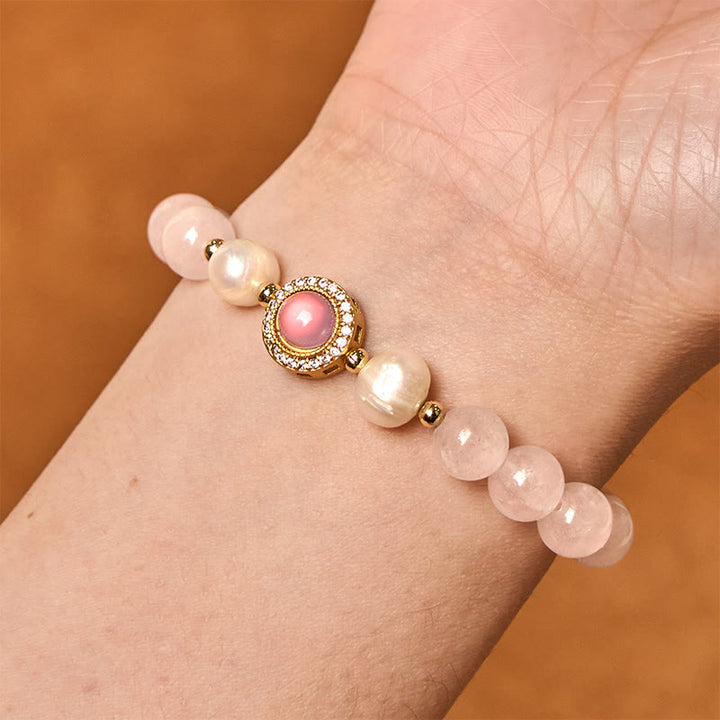 Pulsera de perlas de cristal rosa y Buddha Stones que aporta calidez