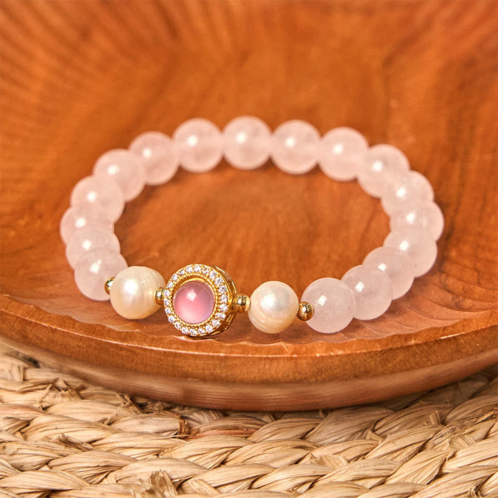 Pulsera de perlas de cristal rosa y Buddha Stones que aporta calidez