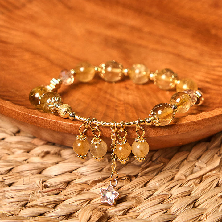 Pulsera de auspiciosidad con trébol de cuatro hojas y estrella de cuarzo rutilado amarillo de color natural de Buddha Stones