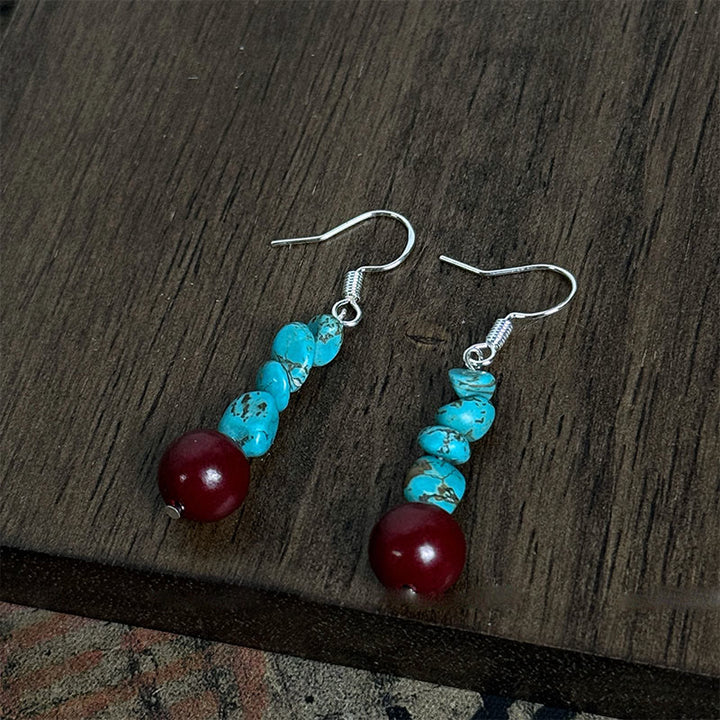Pendientes de protección con cuentas de cinabrio turquesa y Buddha Stones tibetanas de plata de ley 925