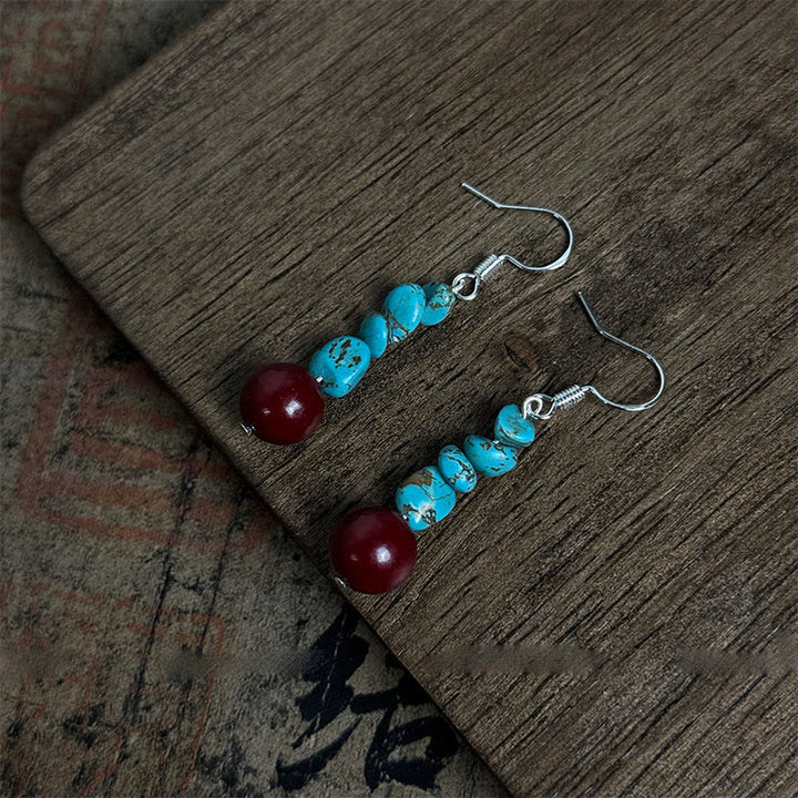 Pendientes de protección con cuentas de cinabrio turquesa y Buddha Stones tibetanas de plata de ley 925