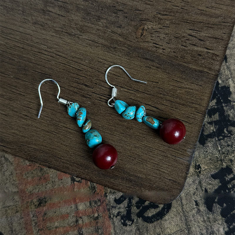 Pendientes de protección con cuentas de cinabrio turquesa y Buddha Stones tibetanas de plata de ley 925
