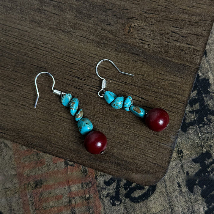 Pendientes de protección con cuentas de cinabrio turquesa y Buddha Stones tibetanas de plata de ley 925