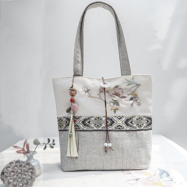 Bolso de hombro de lona y poliéster con bordado de magnolia y Buddha Stones