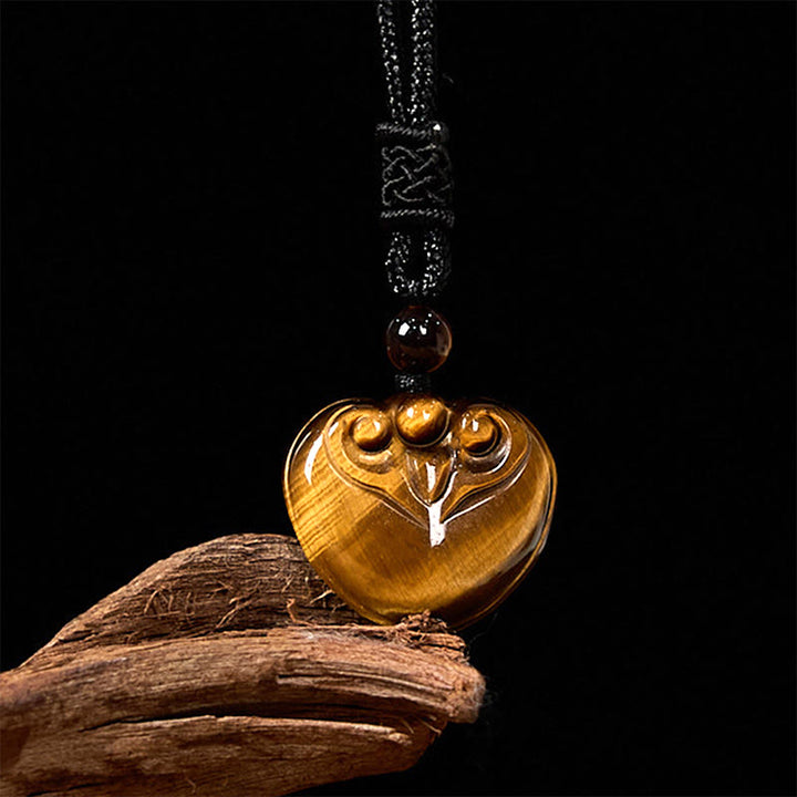 Collar con colgante de cuerda protectora con diseño de corazón de amor y ojo de tigre natural de Buddha Stones