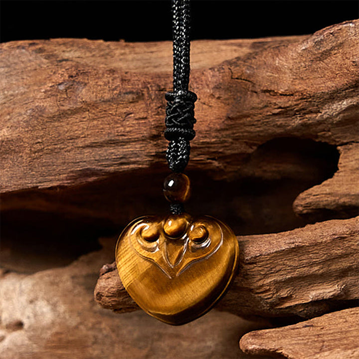 Collar con colgante de cuerda protectora con diseño de corazón de amor y ojo de tigre natural de Buddha Stones