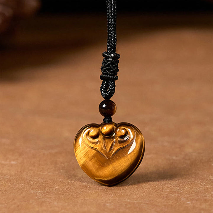 Collar con colgante de cuerda protectora con diseño de corazón de amor y ojo de tigre natural de Buddha Stones