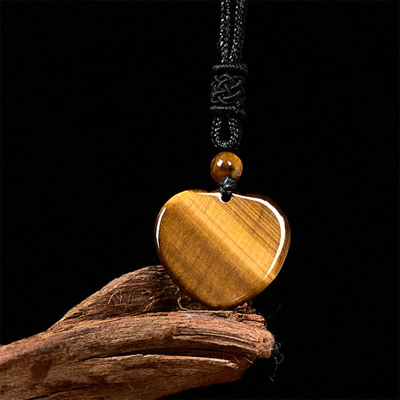 Collar con colgante de cuerda protectora con diseño de corazón de amor y ojo de tigre natural de Buddha Stones