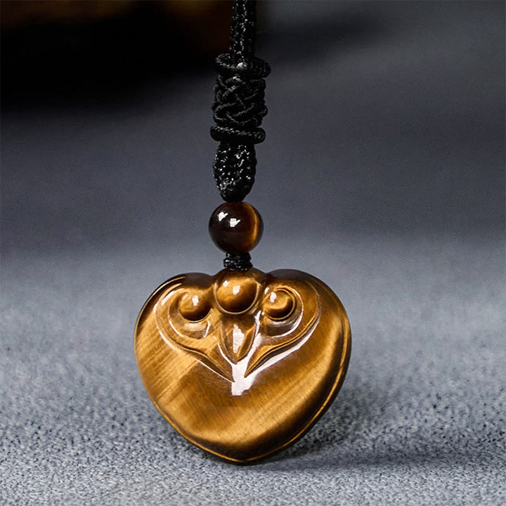 Collar con colgante de cuerda protectora con diseño de corazón de amor y ojo de tigre natural de Buddha Stones