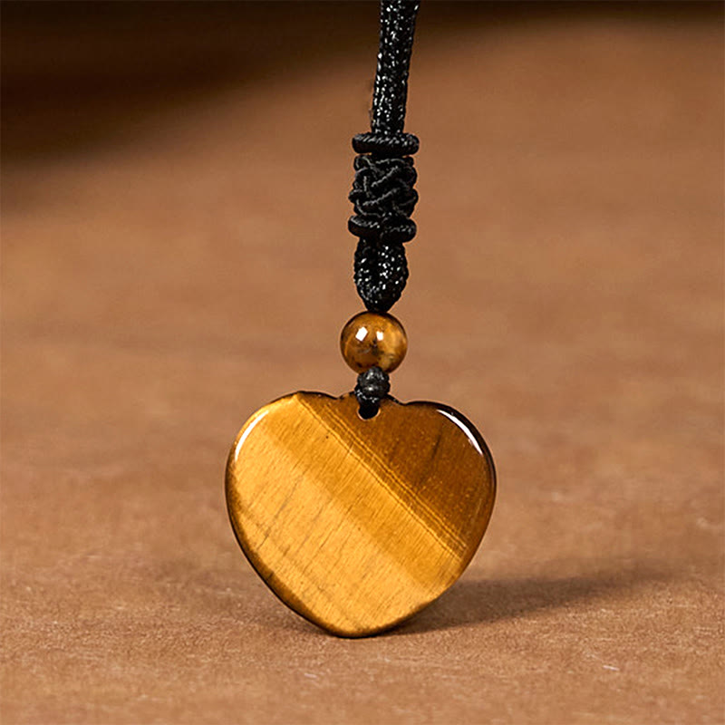 Collar con colgante de cuerda protectora con diseño de corazón de amor y ojo de tigre natural de Buddha Stones