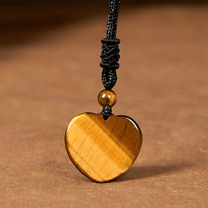 Collar con colgante de cuerda protectora con diseño de corazón de amor y ojo de tigre natural de Buddha Stones