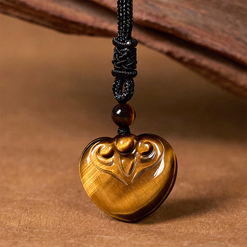 Collar con colgante de cuerda protectora con diseño de corazón de amor y ojo de tigre natural de Buddha Stones