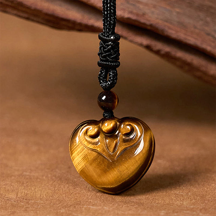 Collar con colgante de cuerda protectora con diseño de corazón de amor y ojo de tigre natural de Buddha Stones