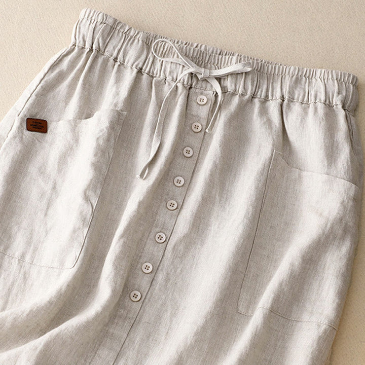 Falda de lino y algodón con bolsillos y diseño de abertura con botones y cordones de Buddha Stones Spring para mujer - image 1