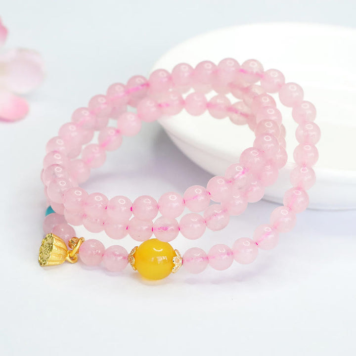Pulsera de loto con cristales rosas y múltiples círculos de calcedonia amarilla y calidez de Buddha Stones - image 1