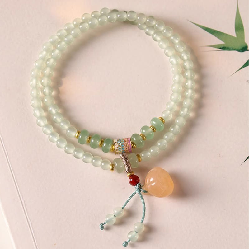 Pulsera de positividad con múltiples círculos de Buddha Stones, aventurina natural, vainas de loto y bambú de la suerte.