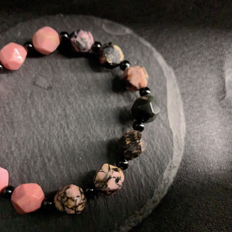 Pulsera curativa con cuentas poligonales de Buddha Stones, rodonita natural, línea negra y punto rojo