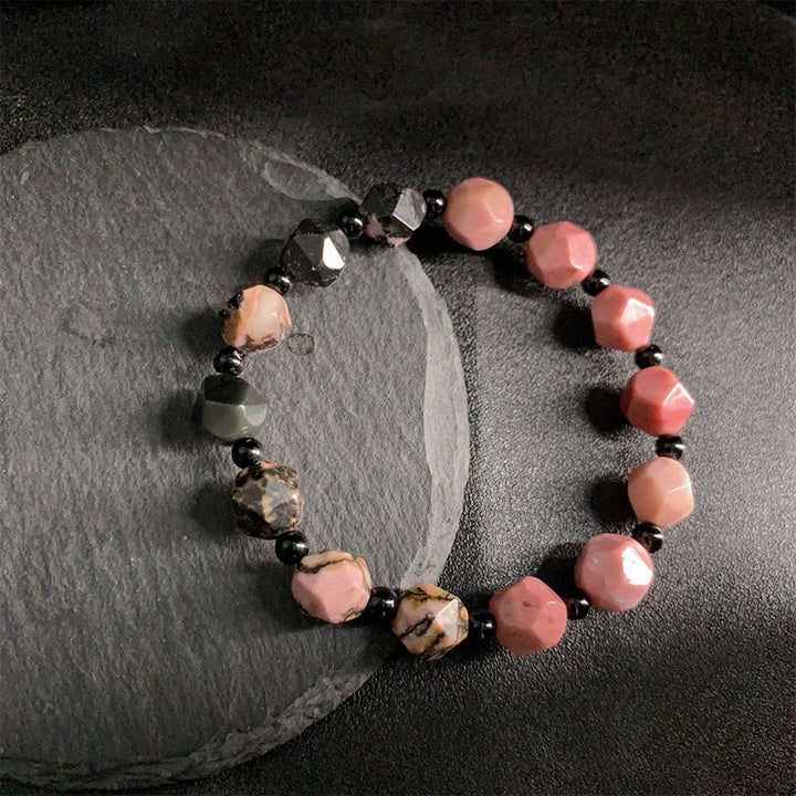 Pulsera curativa con cuentas poligonales de Buddha Stones, rodonita natural, línea negra y punto rojo