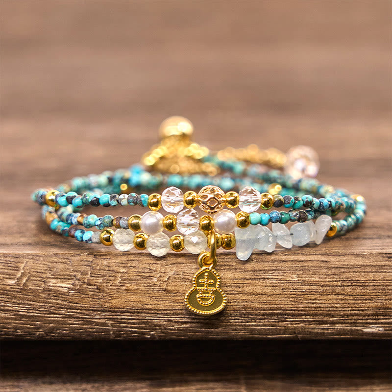 Pulsera de triple vuelta con cuentas de turquesa y Buddha Stones