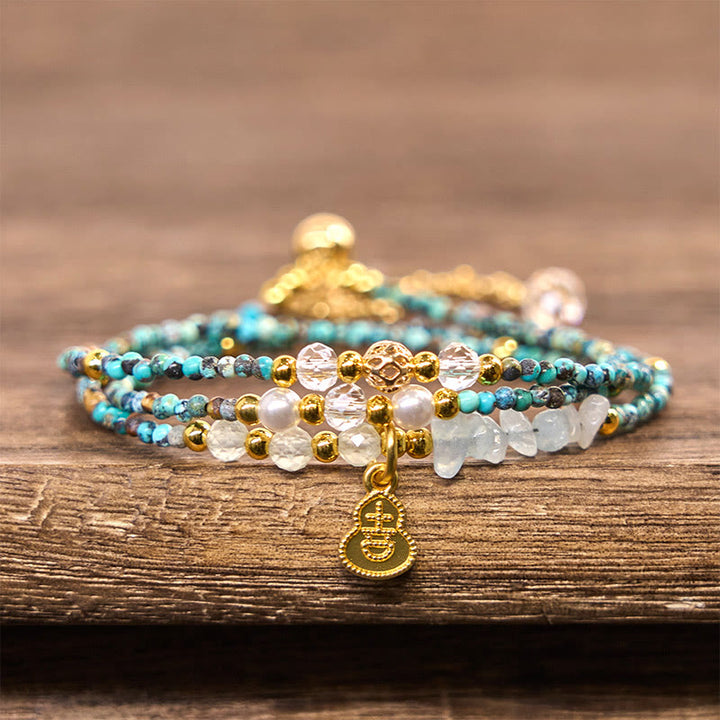 Pulsera de triple vuelta con cuentas de turquesa y Buddha Stones