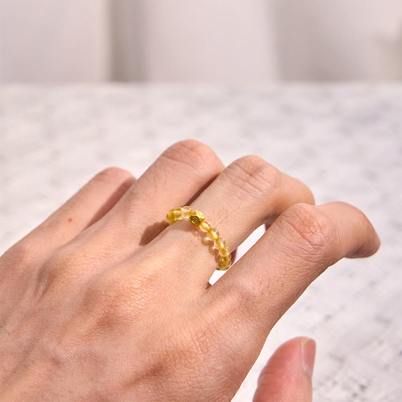 Anillo elástico de riqueza con cuentas de cuarzo rutilado dorado de 3 mm de Buddha Stones