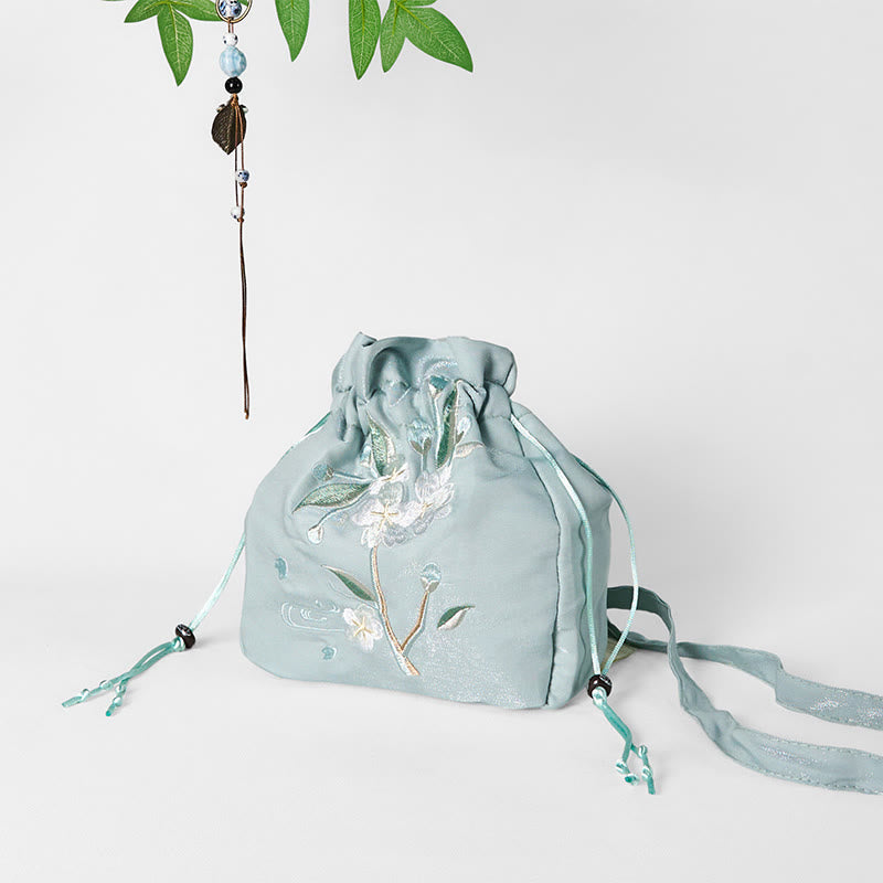 Bolso bandolera de lona con bordado de Buddha Stones, flores verdes y hojas.
