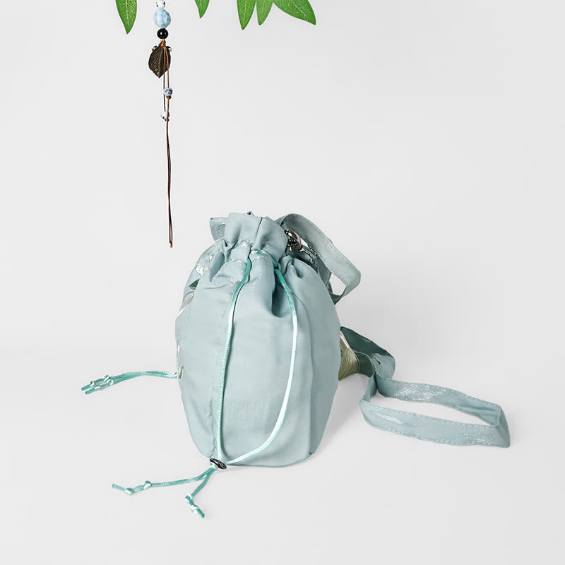 Bolso bandolera de lona con bordado de Buddha Stones, flores verdes y hojas.