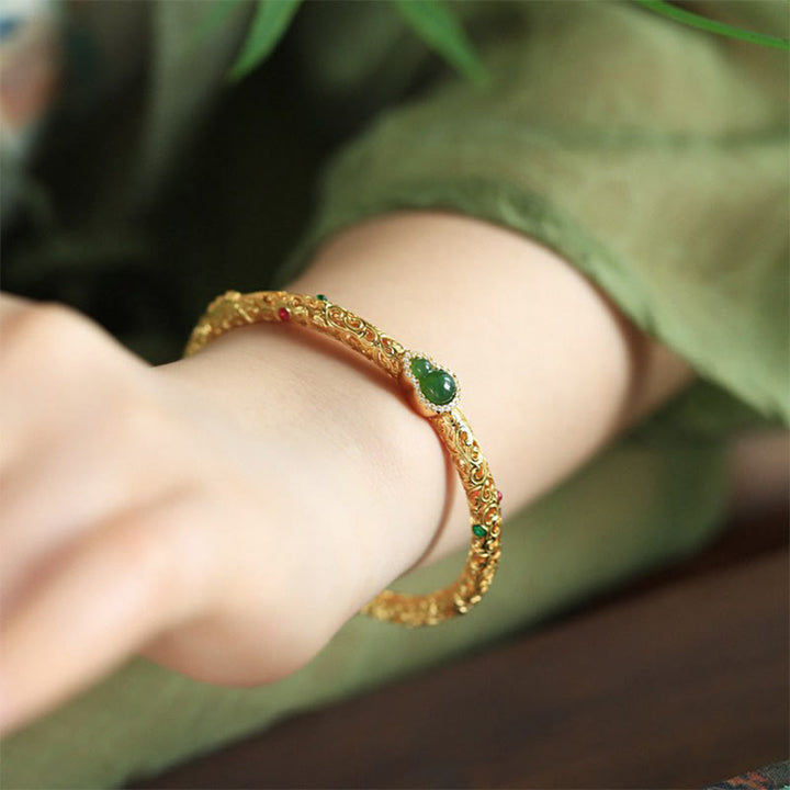 Pulsera de la suerte con calabaza, nubes auspiciosas y Buddha Stones cian bañado en cobre y oro.