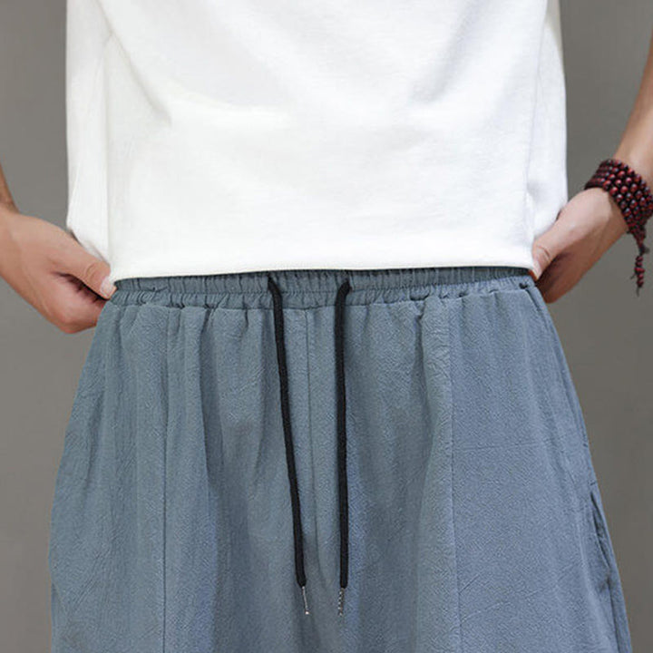 Pantalones casuales Buddha Stones de algodón con cintura elástica, pierna ancha y bolsillos, con cordón ajustable y diseño de entrepierna baja para hombre.