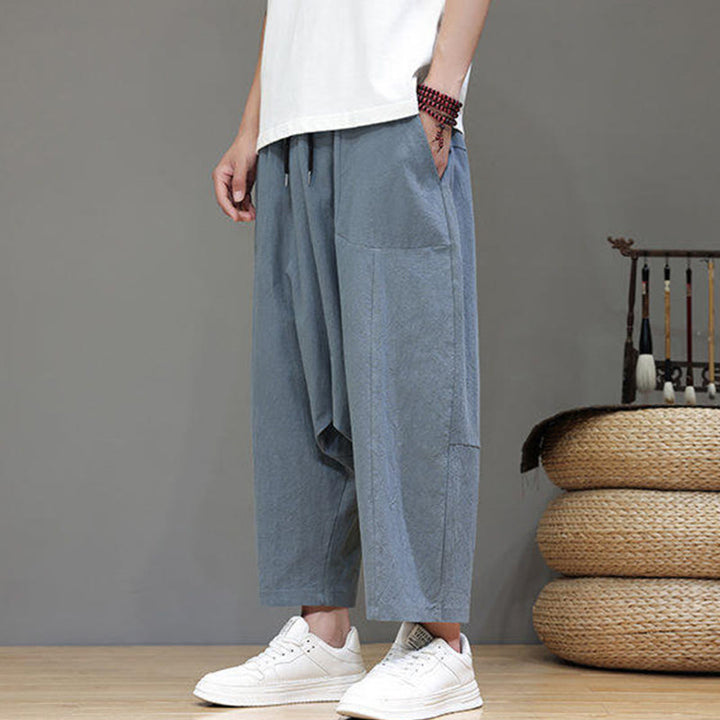 Pantalones casuales Buddha Stones de algodón con cintura elástica, pierna ancha y bolsillos, con cordón ajustable y diseño de entrepierna baja para hombre.