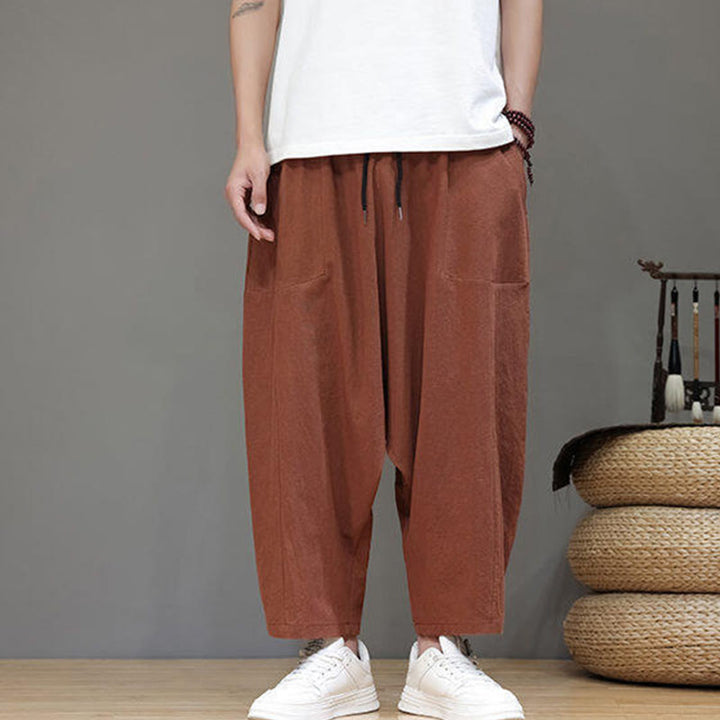 Pantalones casuales Buddha Stones de algodón con cintura elástica, pierna ancha y bolsillos, con cordón ajustable y diseño de entrepierna baja para hombre.