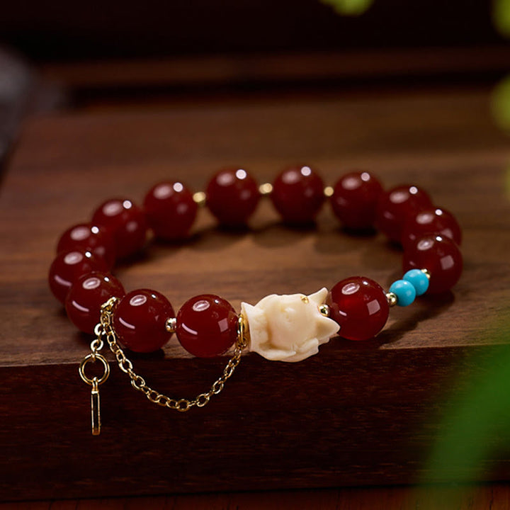 Pulsera de confianza con Buddha Stones, zorro de nueve colas, ágata roja, marfil, fruta, chapado en cobre y oro.