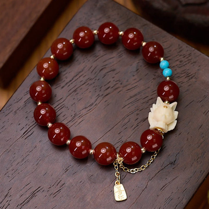 Pulsera de confianza con Buddha Stones, zorro de nueve colas, ágata roja, marfil, fruta, chapado en cobre y oro.