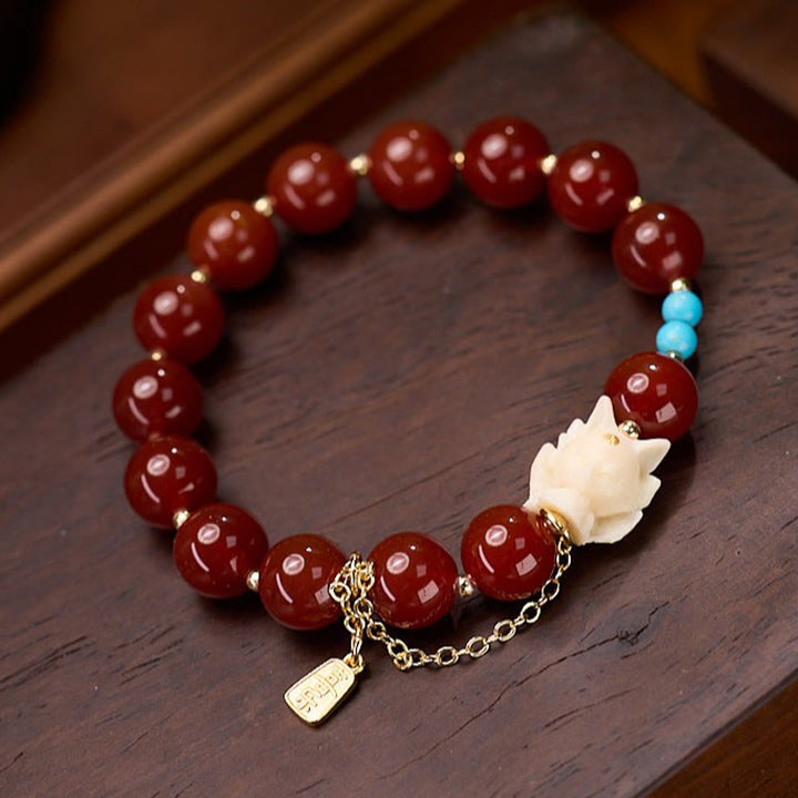Pulsera de confianza con Buddha Stones, zorro de nueve colas, ágata roja, marfil, fruta, chapado en cobre y oro.