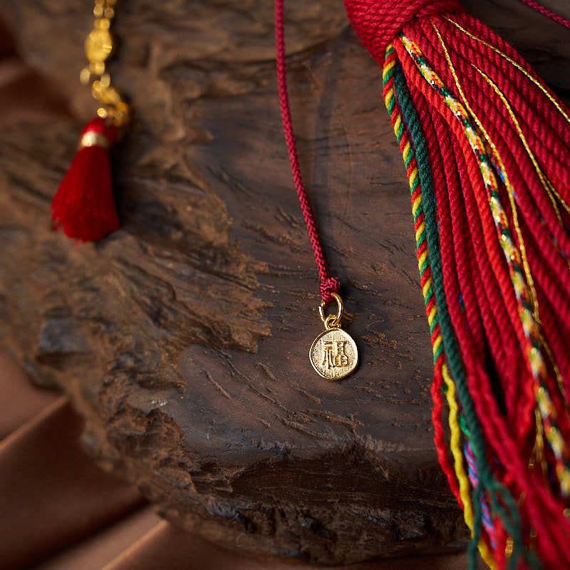 Mala de muñeca con 18 cuentas de Buddha Stones , monedas de cobre, borla tibetana, ágata roja, calmante
