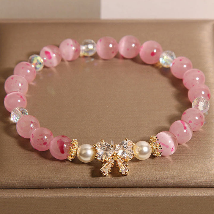 Pulsera de soporte con roseta y lazo de perla de ojo de gato rosa con flor de cerezo y Buddha Stones