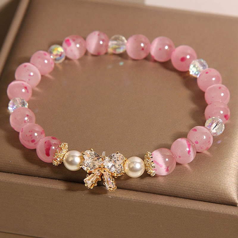 Pulsera de soporte con roseta y lazo de perla de ojo de gato rosa con flor de cerezo y Buddha Stones